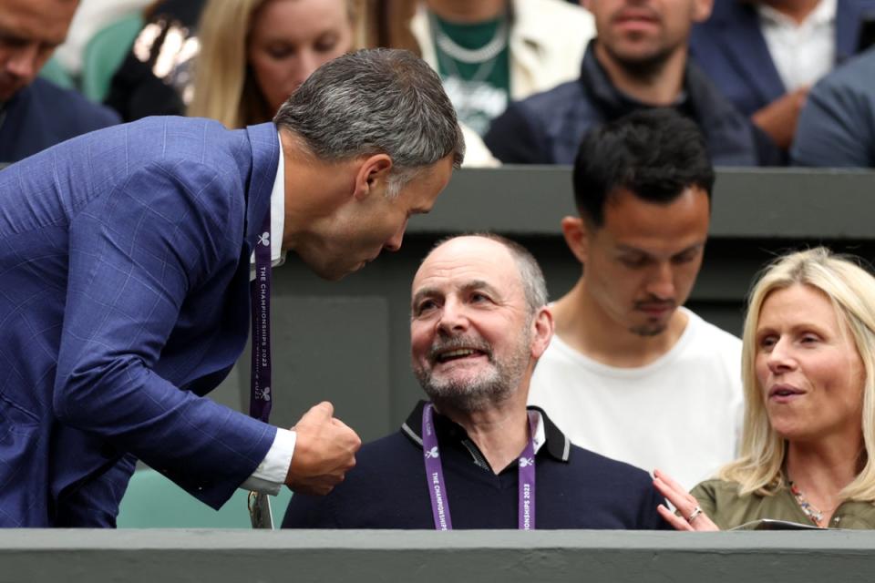 William Murray (seated) talks to his son’s manager Matt Gentry at Wimbledon (Getty Images)