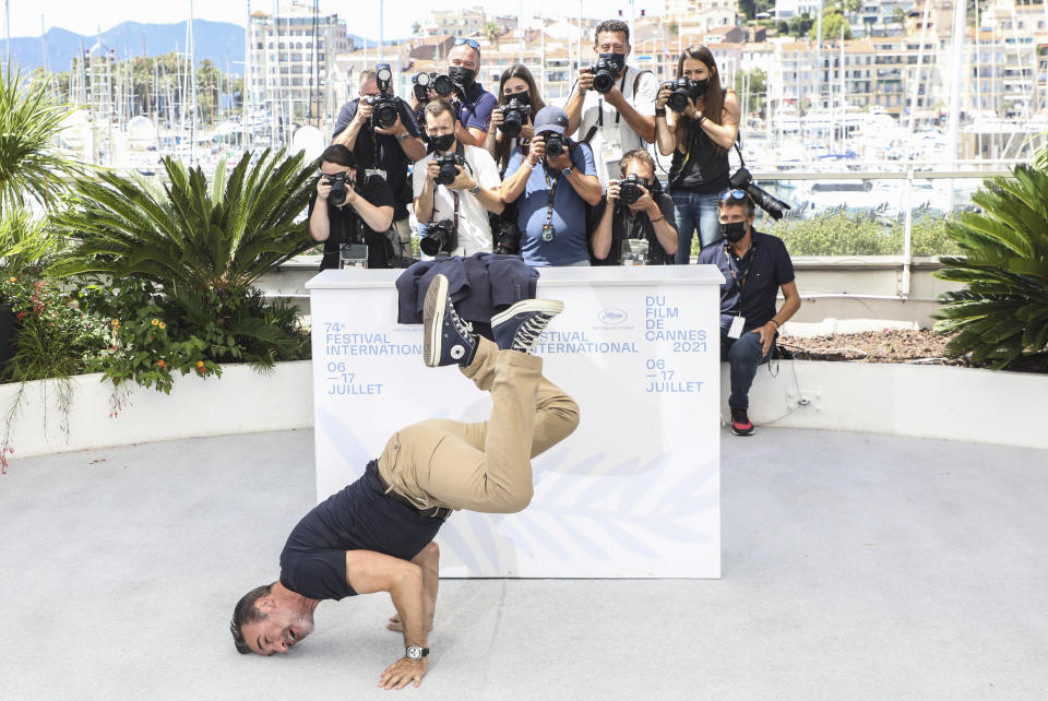 Jean Dujardin poses for photographers at the photo call for the film 'OSS 117: From Africa with Love' at the 74th international film festival, Cannes, southern France, Saturday, July 17, 2021. (Photo by Vianney Le Caer/Invision/AP)