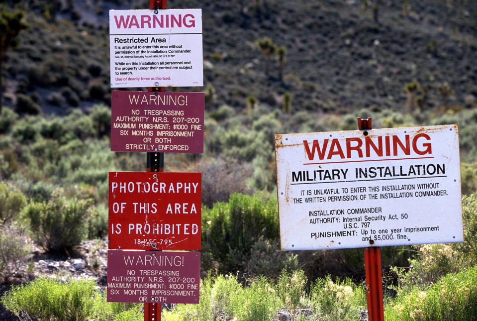 Warning signs at the restricted boundary to Area 51 on an unmarked dirt road near the town of Rachel, Nevada.  (Photo: Larry MacDougal/ZUMA Wire)