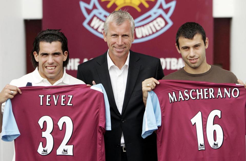 West Ham new signings Carlos Tevez (left) and Javier Mascherano (right) with manager Alan Pardew following a press conference at Upton Park, East London.   (Photo by Sean Dempsey - PA Images/PA Images via Getty Images)