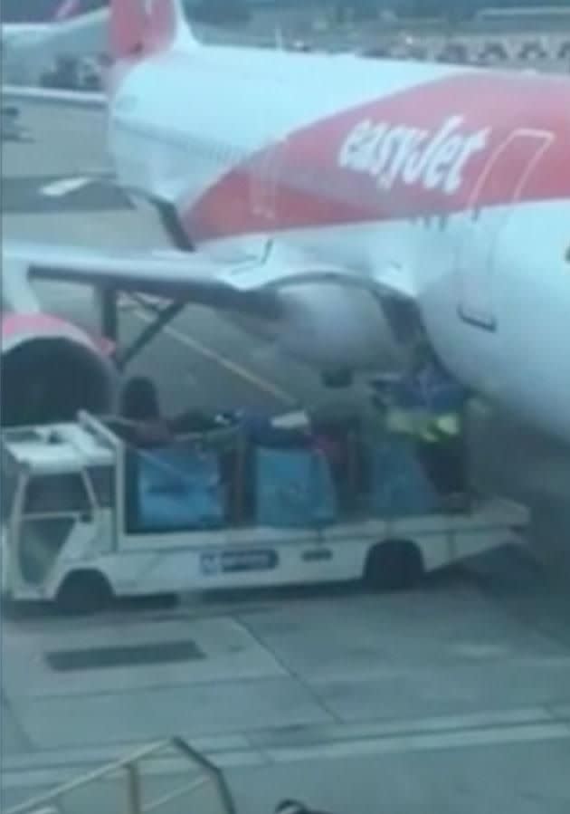 Baggage handlers caught throwing cases at Gatwick airport. Photo: YouTube