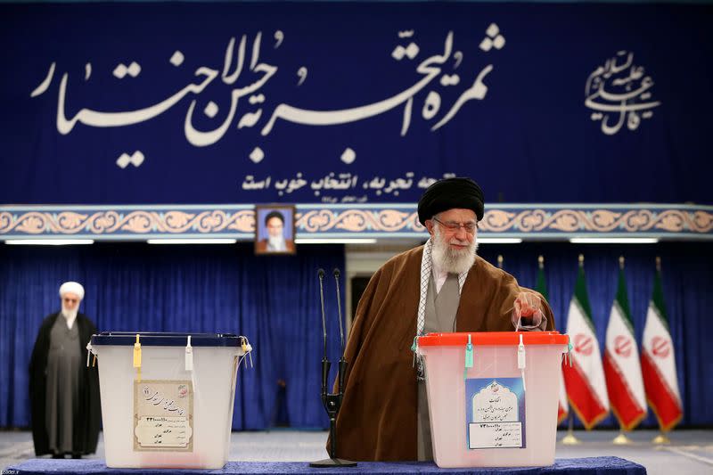 Iran's Supreme Leader Ayatollah Ali Khamenei casts his vote at a polling station during parliamentary elections in Tehran