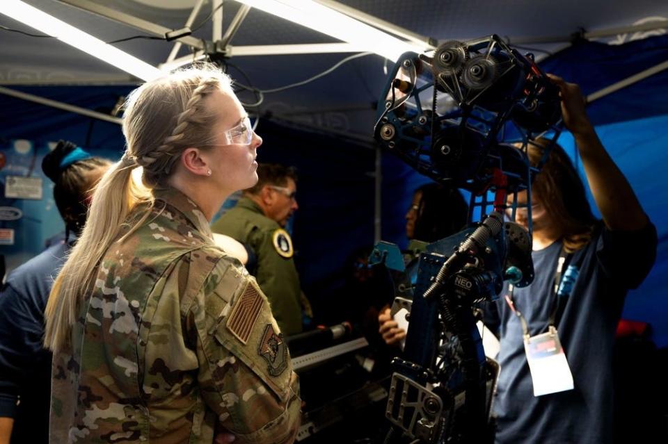 Madison Marsh chats with students at the FIRST Robotics Championship in Houston, Texas.