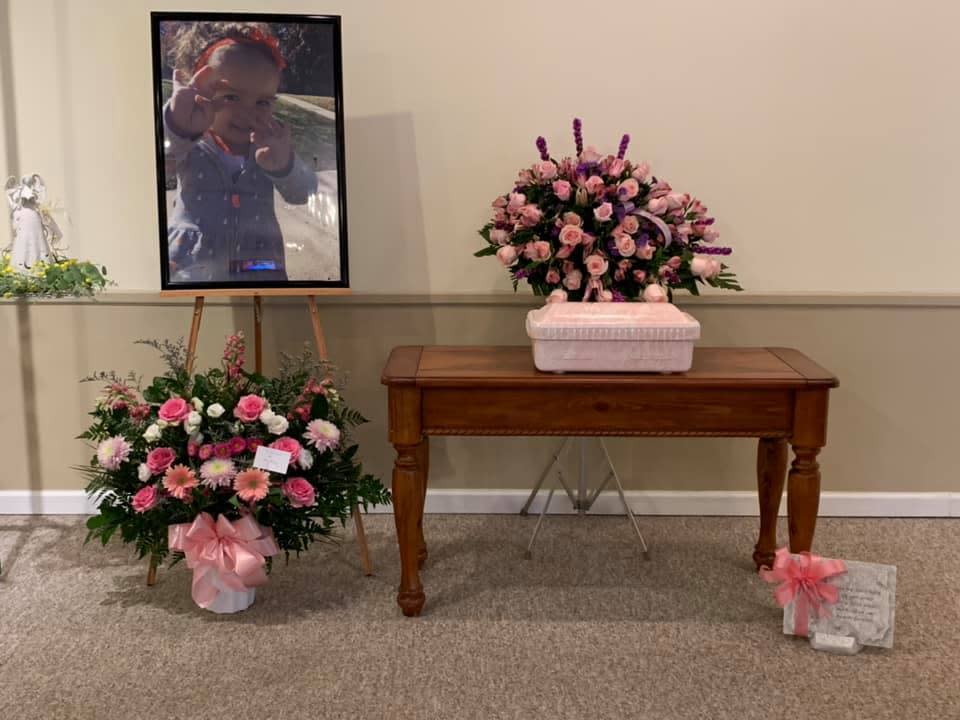 The casket of Emma Grace Cole rests on a table inside Chandler Funeral Home in Ellettsville, Ind., on March 31, 2021. Cole is believed to have died in the summer of 2019, but she wasn't identified until the fall of 2020. Her remains were released to her father in March 2021.