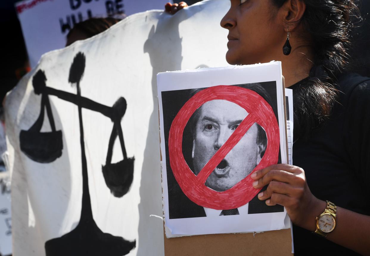 Demonstrators in Los Angeles hold anti-Kavanaugh signs and banners on Sept. 28, one day after Christine Blasey Ford testified before the Senate Judiciary Committee concerning Supreme Court nominee Brett Kavanaugh. The ACLU says her testimony was credible.&nbsp; (Photo: MARK RALSTON via Getty Images)