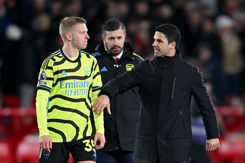 Oleksandr Zinchenko of Arsenal and Mikel Arteta, Manager of Arsenal, interact after the team's victory in the Premier League match between Nottingham Forest and Arsenal FC at City Ground on January 30, 2024 in Nottingham, England.