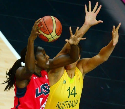 Australian center Elizabeth Cambage (R) challenges US centre Tina Charles during the London 2012 Olympic Games women's semifinal basketball match. Four-time defending champion United States advanced to the Olympic women's basketball final with an 86-73 victory over Australia