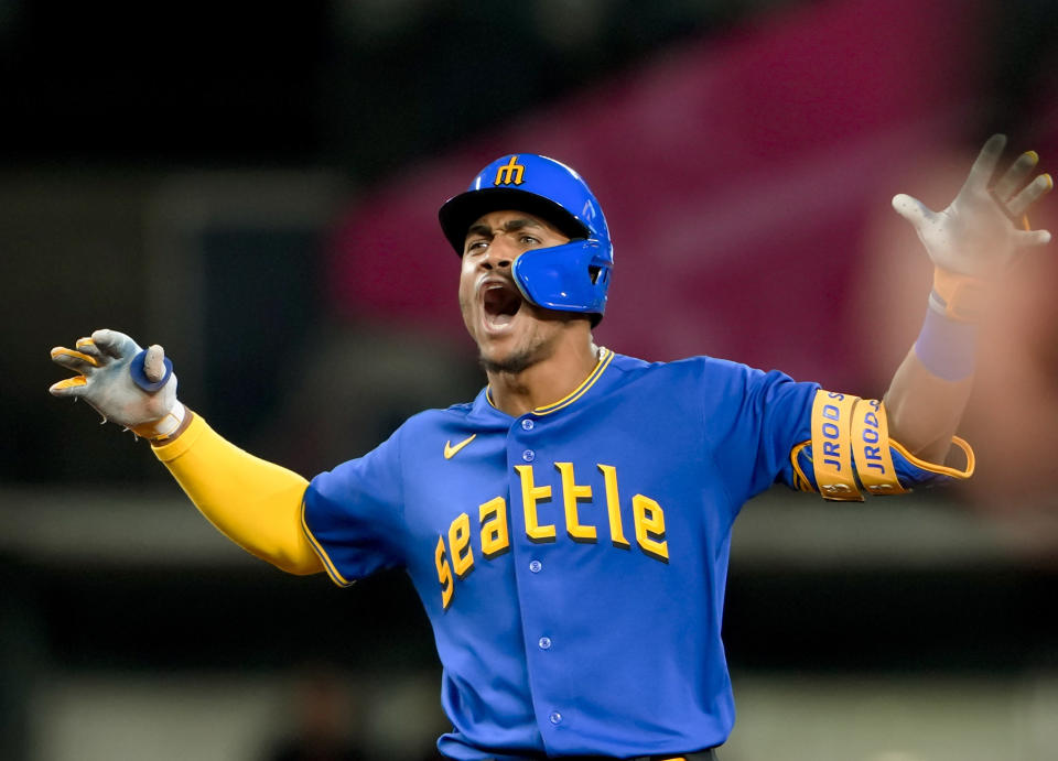 Seattle Mariners' Julio Rodríguez reacts after hitting an RBI double against the Baltimore Orioles during the sixth inning of a baseball game Friday, Aug. 11, 2023, in Seattle. (AP Photo/Lindsey Wasson)