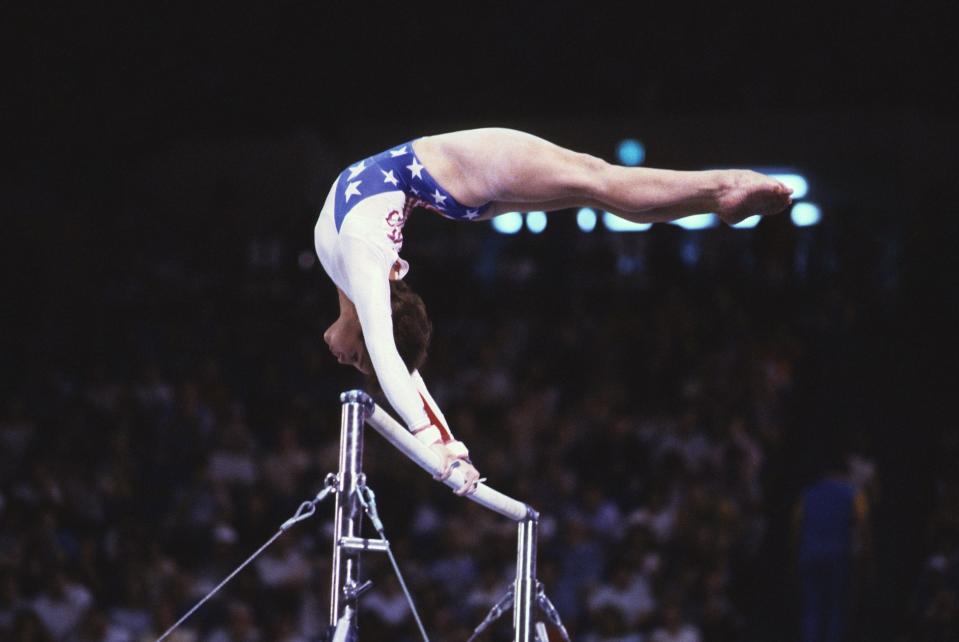 Mary Lou Retton in action on the uneven bars at Pauley Pavillon during the 1984 Los Angeles Olympics.