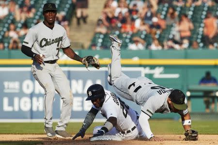 May 26, 2018; Detroit, MI, USA; Chicago White Sox second baseman Yoan Moncada (10) falls over a sliding Detroit Tigers shortstop Niko Goodrum (28) in front of shortstop Tim Anderson (7) after he makes a throw to first in an attempted double play as into second in the eighth inning at Comerica Park. Mandatory Credit: Rick Osentoski-USA TODAY Sports