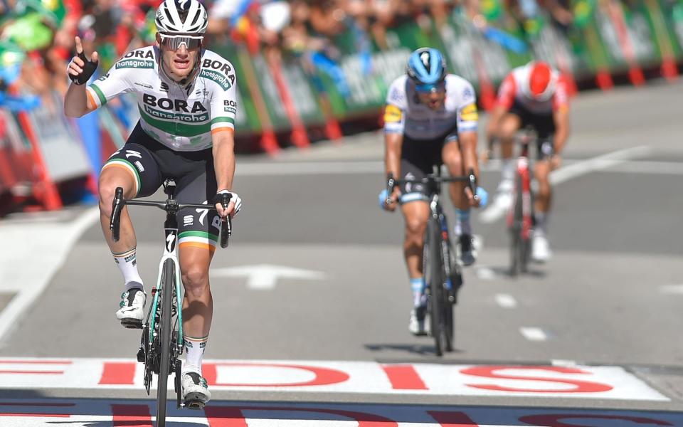 Sam Bennett crosses the line to win stage 14 at the Vuelta a España on Saturday - AFP or licensors