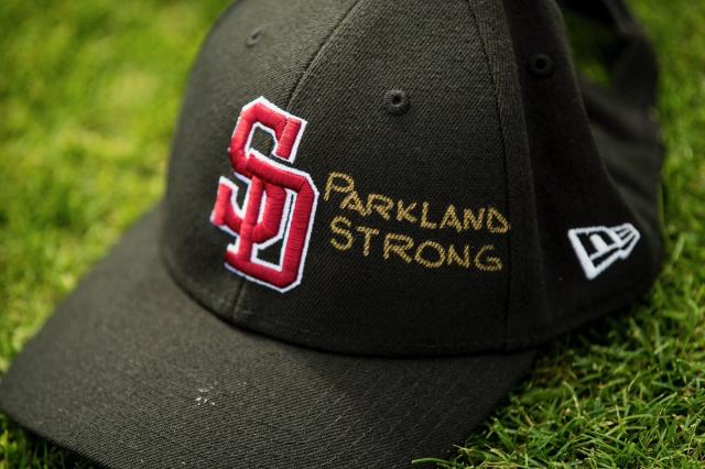 MLB teams wearing Marjory Stoneman Douglas High School caps at