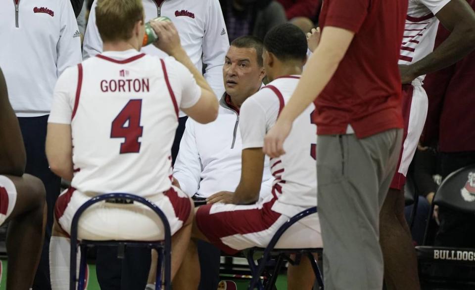 Fresno State coach Justin Hutson leads the Bulldogs through a timeout in a 108-72 victory over Chicago State to end the regular season.