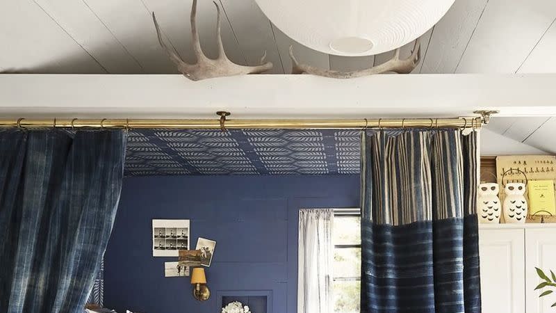 canopy bed with blue curtains