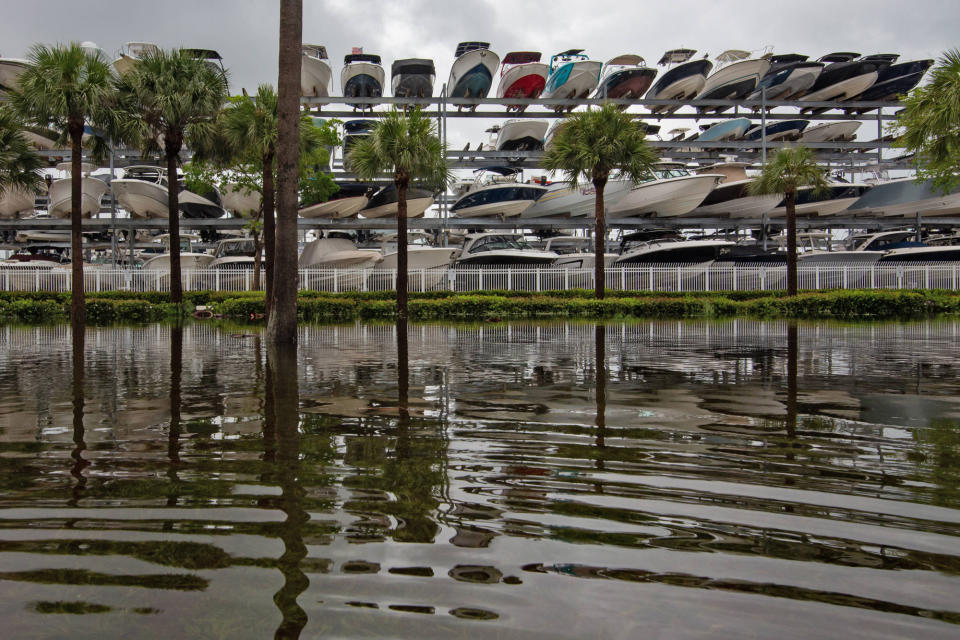 <p>Boats in Miami are lifted out of the water on Sept. 28 ahead of Ian's arrival.</p>