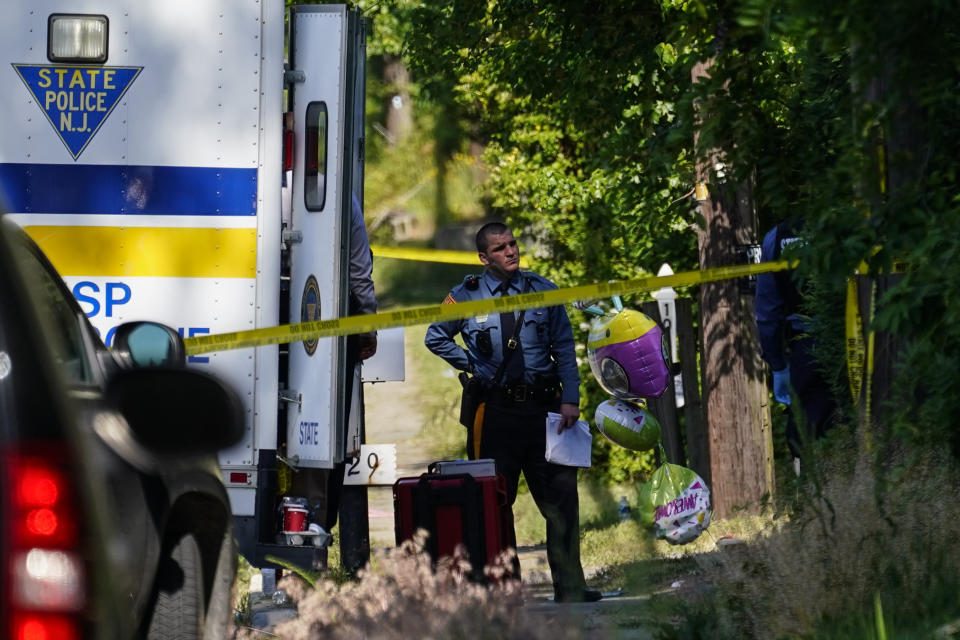 Police gather at the scene of a shooting in Fairfield Township, New Jersey.