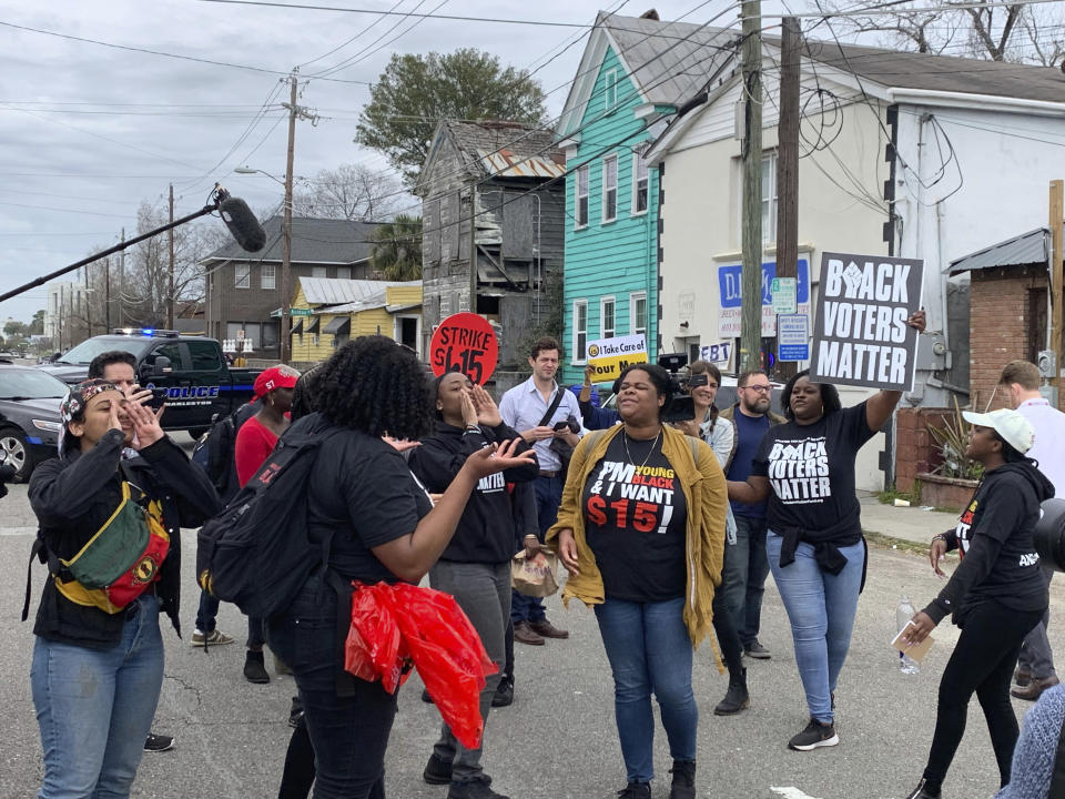 Demonstrators affiliated with Black Voters Matter and Black Youth Project 100 protest former South Bend, Ind., Mayor and Democratic presidential candidate Pete Buttigieg in North Charleston, S.C. on Monday, Feb. 24, 2020. The political divide between the black church and black activism was on full display this week in Charleston as Buttigieg worked to garner support among a constituency he has struggled to excite. (Jack Jenkins/Religion News Service via AP)