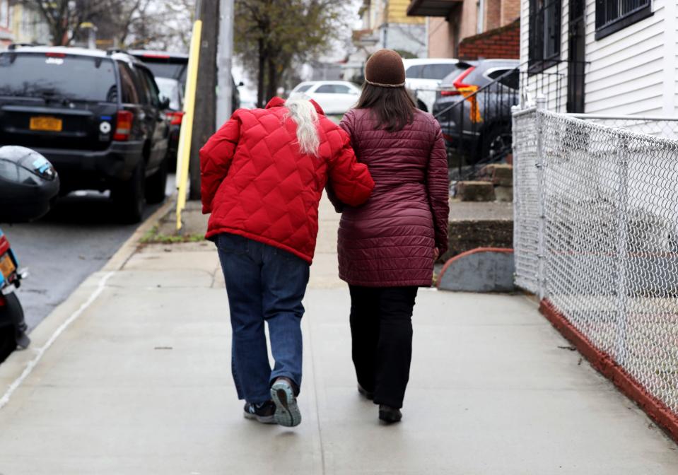 This 2022 file photo shows Maggie Ornstein, 44, taking her mother Janet, 77, for a walk in their Queens neighborhood on March 24 2022. Janet suffered a cerebral aneurysm in 1996 when Maggie was 17 years-old and suffered cognitive impairment. As a result, she has required constant caregiving ever since. Maggie, who holds a doctoral degree and three masters degrees, has spent her entire adult life living with and caring for her mother.