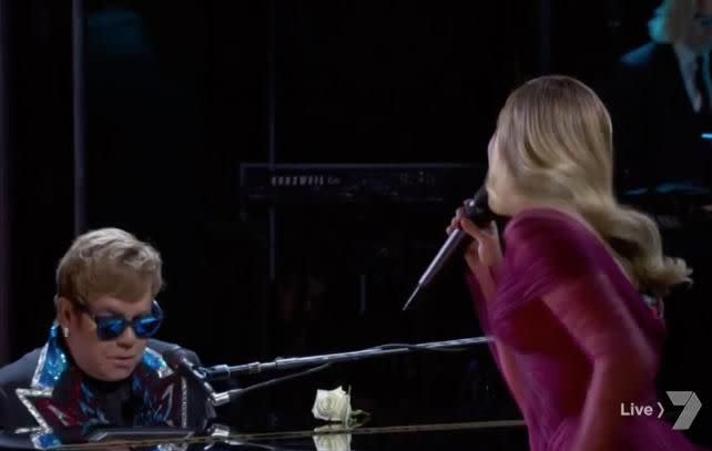 Instead he looked down at his piano, looking as if he was concentrating on the notes he was playing. Source: CBS / Seven