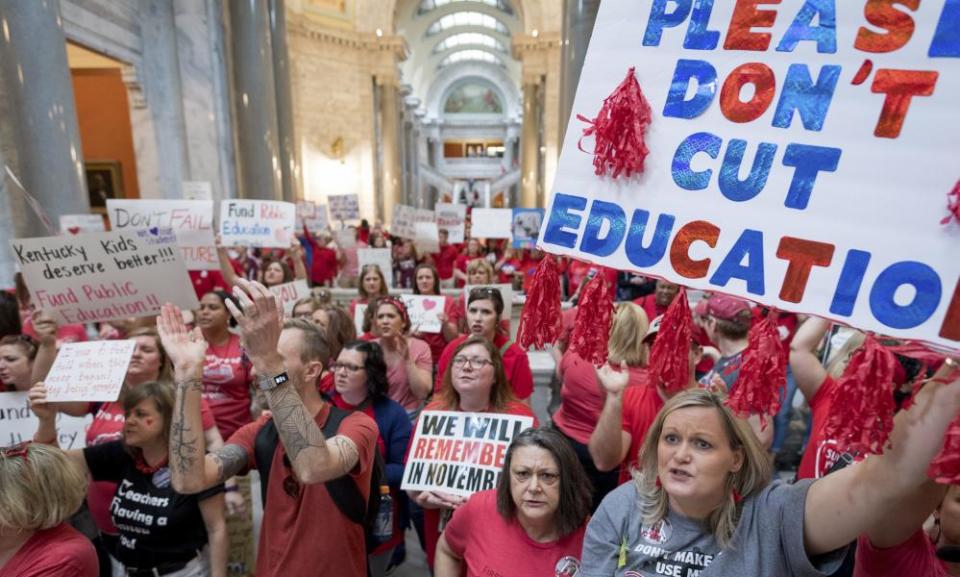 Teachers from across Kentucky gather inside the state capitol to rally for increased funding on 13 April.