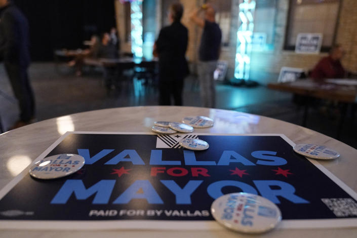 Pins and a sign for Chicago mayoral candidate Paul Vallas are displayed on a table at Vallas' election night event in Chicago, Tuesday, Feb. 28, 2023. The race is expected to go to an April 4 runoff between the top two vote-getters. (AP Photo/Nam Y. Huh)