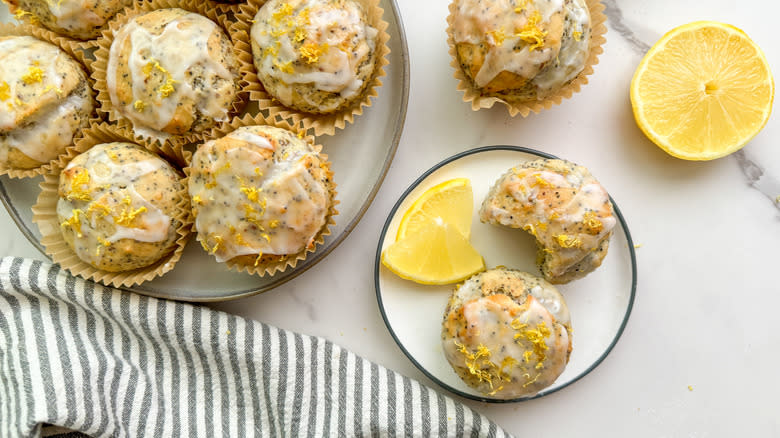 iced lemon poppy seed muffins on plates