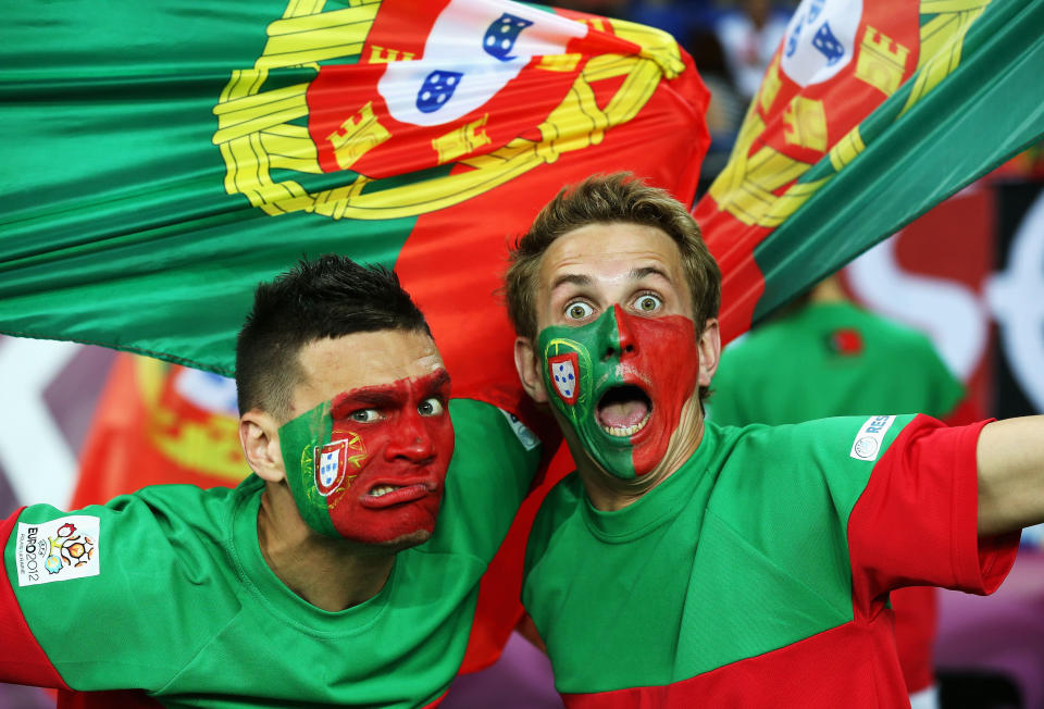 KHARKOV, UKRAINE - JUNE 17: Portugal fans enjoy the atmosphere during the UEFA EURO 2012 group B match between Portugal and Netherlands at Metalist Stadium on June 17, 2012 in Kharkov, Ukraine. (Photo by Julian Finney/Getty Images)