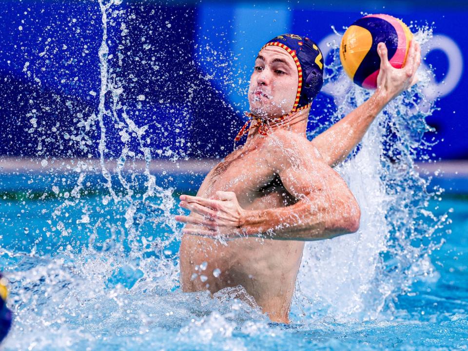 Alberto Munarriz of Spain leaps from the water during water polo