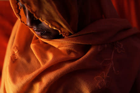 Rihana Begum, a 30-year-old Rohingya refugee and mother of five, is photographed at their shelter at the camp for widows and orphans inside the Balukhali camp near Cox's Bazar, Bangladesh, December 5, 2017. REUTERS/Damir Sagolj