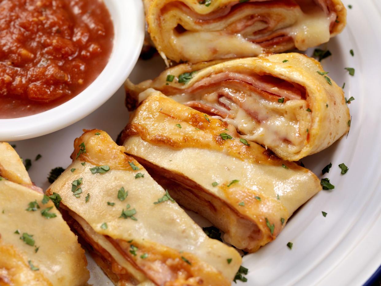 Authentic Hand Made Italian Stromboli with Pepperoni, Ham, Fresh Parmesan and Marinara Sauce  - Photographed on a Hasselblad H3D11-39 megapixel Camera System