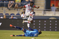 Philadelphia Union goalkeeper Andre Blake, left, defends the shot by Toronto FC defender Kemar Lawrence, right, during the first half of an MLS soccer match, Wednesday, Aug. 4, 2021, in Chester, Pa. (AP Photo/Christopher Szagola)