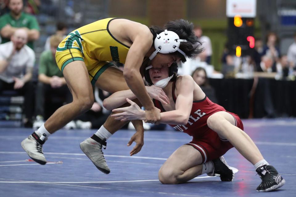 Tuttle's Chance Fisher, right, wrestles Catoosa's Josh Esquivel  during the Class 4A 106-pound match during the dual state wrestling tournament finals at Stride Bank Center in Enid, Okla., Saturday, Feb. 11, 2023. 