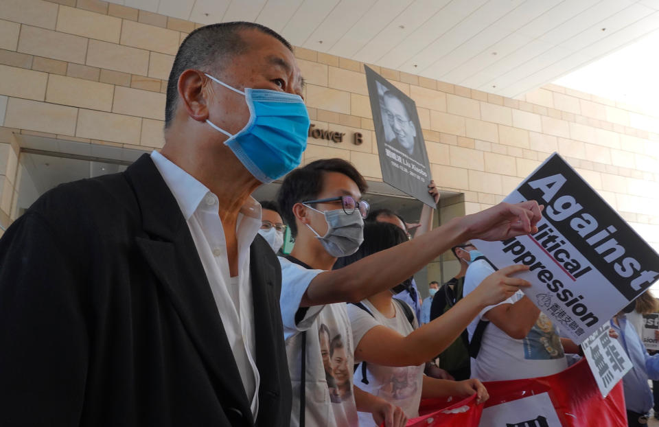 Hong Kong media tycoon Jimmy Lai, founder of the local newspaper Apple Daily, arrives outside a district court in Hong Kong, Monday, July 13, 2020. Activists including Lai who organized the June 4th Tiananmen massacre memorial this year, which was banned by police because of anti-virus social distancing reasons, had to make an appearance in court for charges for organizing and participating in the memorial. (AP Photo/Vincent Yu)