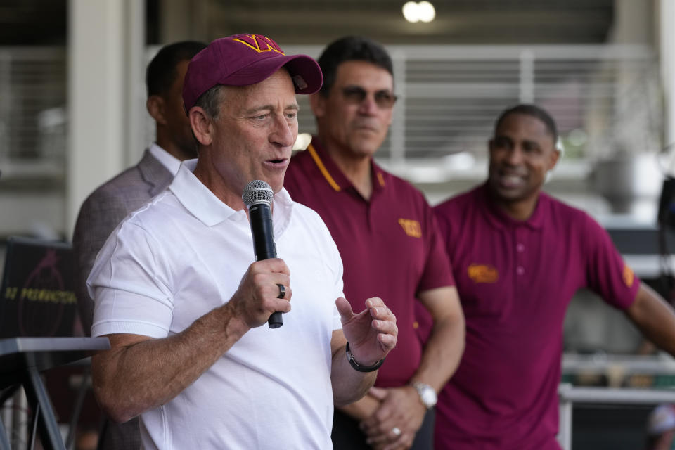 Josh Harris, the leader of a group buying the Washington Commanders, speaks at an NFL football pep rally at FedEx Field in Landover, Md., Friday, July 21, 2023. (AP Photo/Alex Brandon)