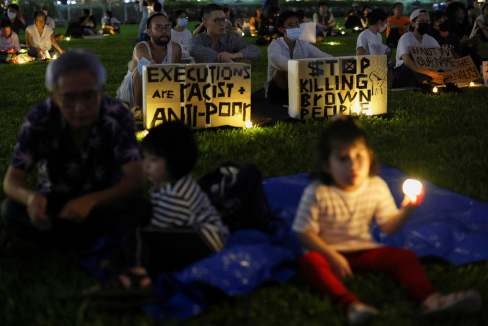 People take part in a vigil ahead of the planned executions of Malaysians Nagaenthran Dharmalingam and Datchinamurthy Kataiah at Hong Lim Park in Singapore, April 25, 2022. — Reuters pic