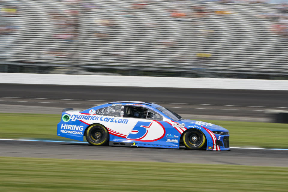 Kyle Larson (5) drives through a turn during practice for the NASCAR Cup Series auto race at Indianapolis Motor Speedway in Indianapolis, Saturday, Aug. 14, 2021. (AP Photo/Michael Conroy)