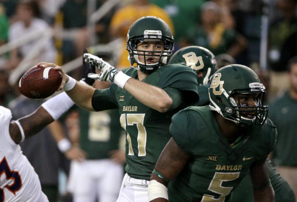 Baylor quarterback Seth Russell (17) prepares to pass as Shock Linwood provides protection in the first half of an NCAA college football game against Northwestern State, Saturday, Sept. 6, 2014, in Waco, Texas. (AP Photo/Tony Gutierrez)