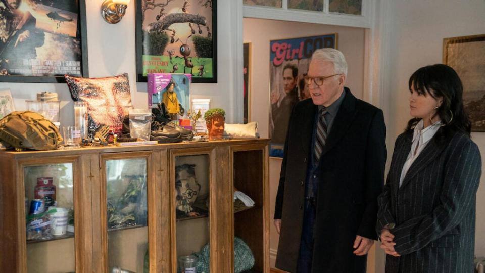 Charles (Steve Martin) and Mabel (Selena Gomez), look at a shelf of Ben Glenroy (Paul Rudd) memorabilia in Season 3, Episode 2. (Patrick Harbron/Hulu)
