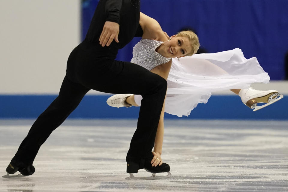 FILE - Canada's Kaitlyn Weaver and Andrew Poje perform their ice dance free dance during the ISU World Team Trophy Figure Skating competition Friday, April 12, 2019, in Fukuoka, southwestern Japan. Canadian ice dancer Kaitlyn Weaver says, as an LGBTQ person, her sport has never fully reflected her lived experience. Skate Canada last month dropped the requirement that an ice dance or pairs team competing domestically must include a man and a woman. (AP Photo/Toru Hanai, File)