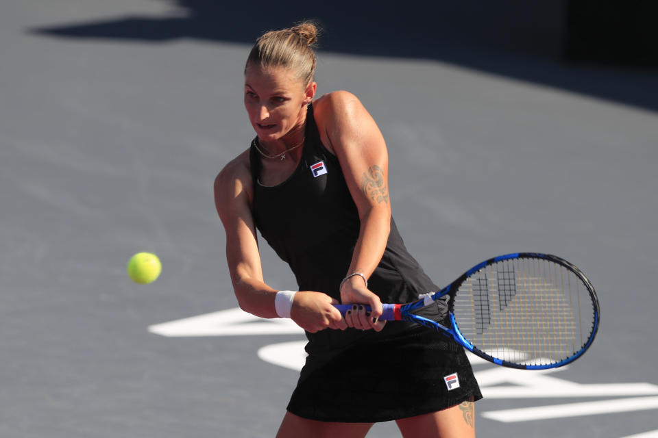 Karolina Pliskova of the Czech Republic, returns a shot to Anett Kontaveit of Estonia, during a Mexican Tennis WTA Finals match, in Guadalajara, Mexico, Friday, Nov. 12, 2021. (AP Photo/Refugio Ruiz)