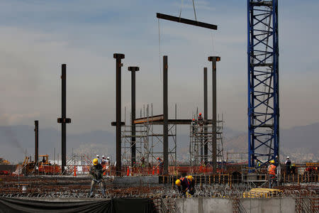 Employees work on the control tower foundations at the construction site of the new Mexico City International Airport in Texcoco, on the outskirts of Mexico City, Mexico February 1, 2018. Picture taken February 1, 2018. REUTERS/Carlos Jasso