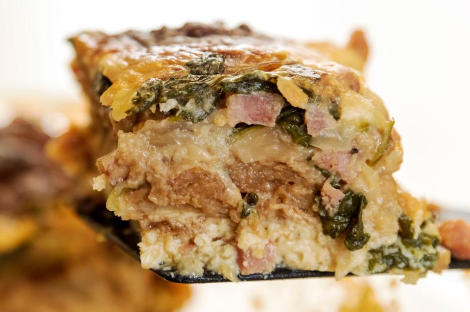 This breakfast casserole is made with eggs, whole milk, mini croissants, diced ham, sweet onions, baby spinach, a touch of dijon mustard and fontina cheese. 