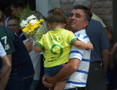 A girl wearing Emiliano Sala's jersey, former striker of French club Nantes, who died in a plane crash in the English Channel, attends his wake in Progreso, Argentina February 16, 2019. REUTERS/Sebastian Granata
