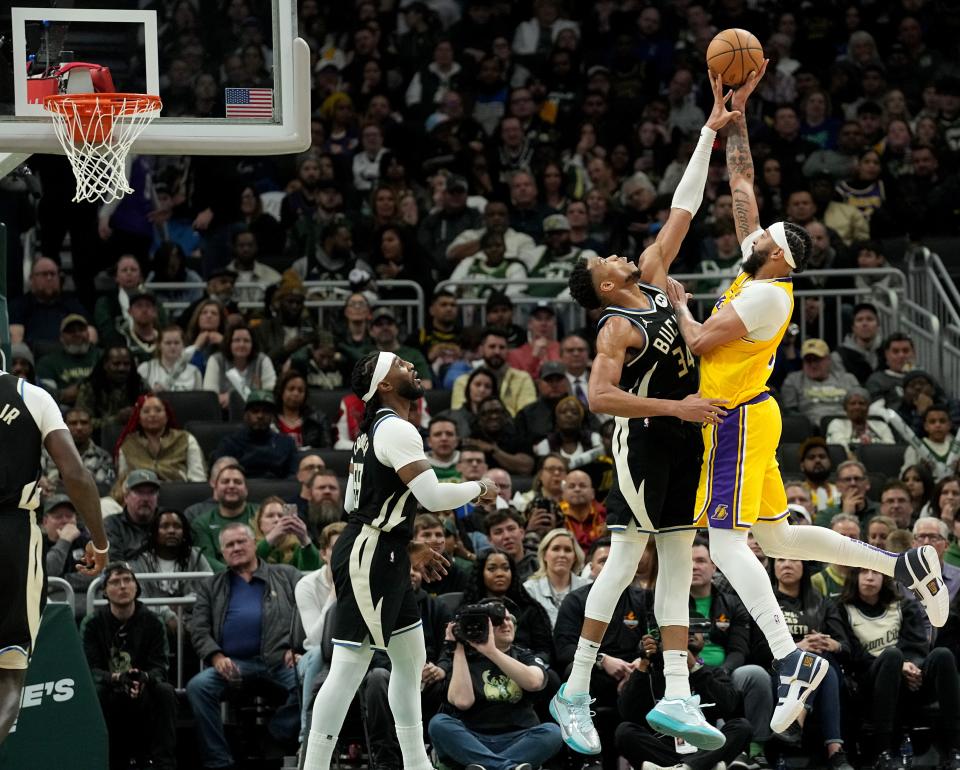 Milwaukee Bucks forward Giannis Antetokounmpo blocks a shot by Los Angeles Lakers forward Anthony Davis during the second half of their game Tuesday. Antetokounmpo had three blocks in the game and a triple-double overall.