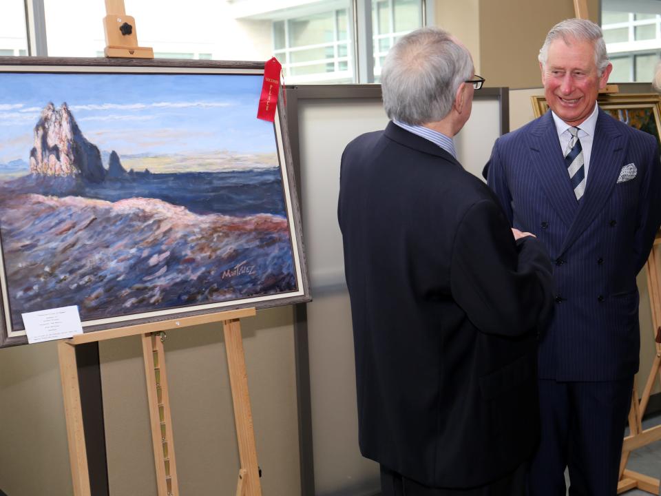Prince Charles and Camilla with one of his paintings.