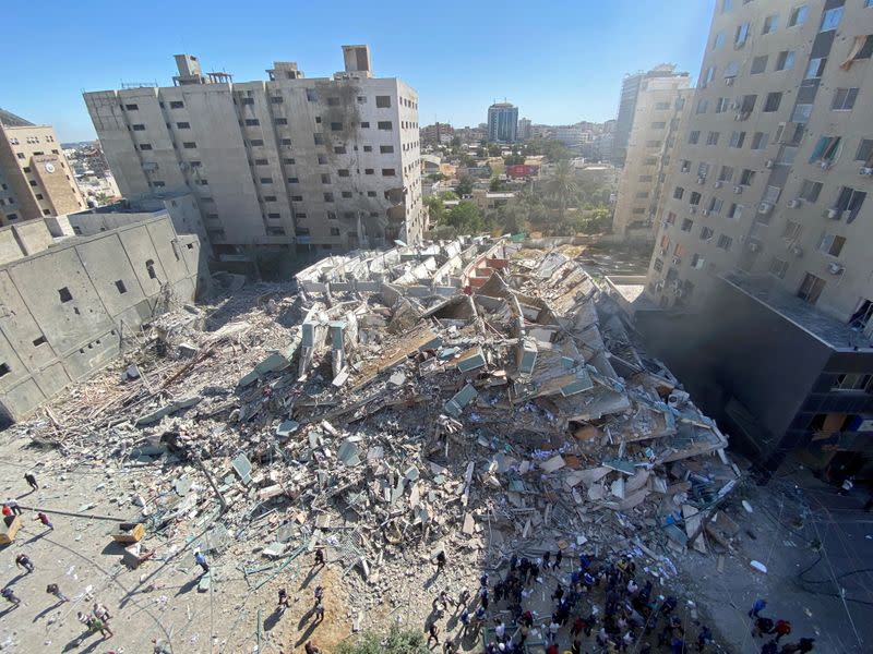 FILE PHOTO: A tower housing AP, Al Jazeera offices collapses after Israeli missile strikes in Gaza city