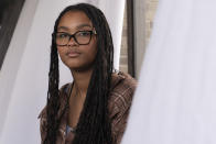 Harmony Kennedy, 16, a high school student, sits for a portrait in Nolensville, Tenn., on Tuesday, May 16, 2023. The first encounter with racism that Kennedy can remember came in elementary school. On a playground, a girl picked up a leaf and said she wanted to clean Harmony’s skin because it was “dirty.” (AP Photo/George Walker IV)