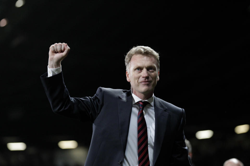 Manchester United manager David Moyes celebrates after his team's 3-0 Champions League last 16 second leg soccer match win against Olympiakos at Old Trafford Stadium, Manchester, England, Wednesday, March 19, 2014. (AP Photo/Jon Super)