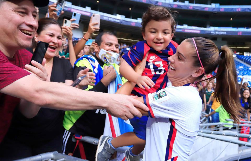 Alex Morgan celebrates with fan Luca. (Alfredo Lopez / Jam Media / Getty Images)