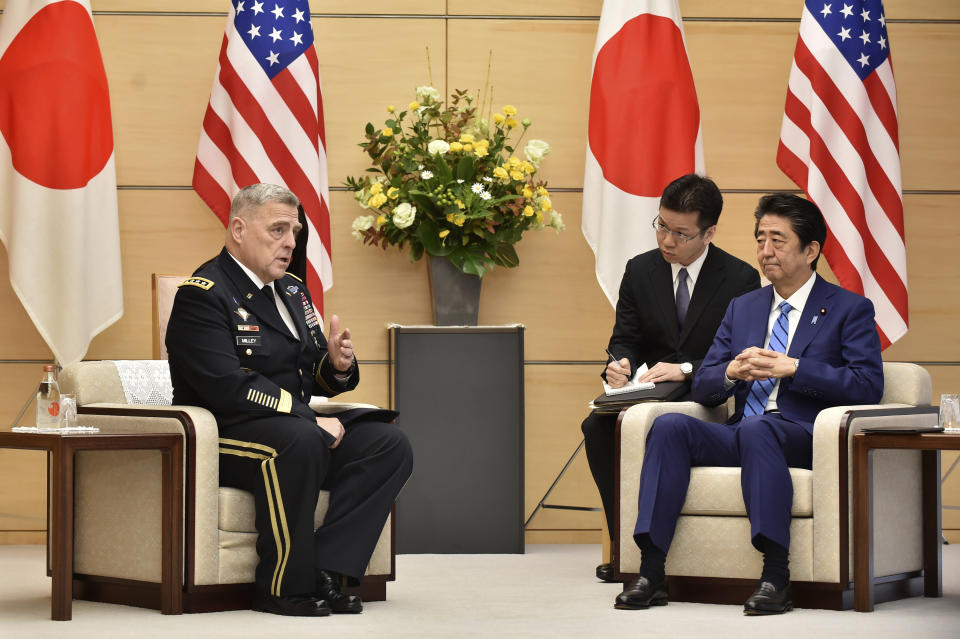 Japan's Prime Minister Shinzo Abe, right, meets with U.S. Chairman of the Joint Chiefs of Staff Gen. Mark Milley, left, prior to their talks at the Abe's office in Tokyo Tuesday, Nov. 12, 2019. (Kazuhiro Nogi/Pool Photo via AP)